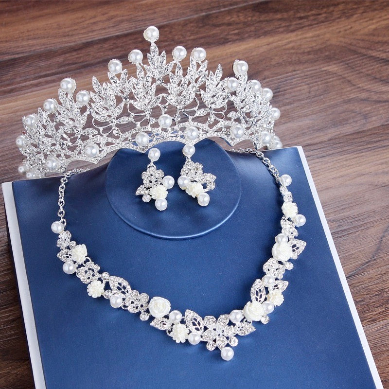 https://www.adorabysimona.com/products/tosca-pearl-and-crystal-3-piece-bridal-jewelry-set-with-tiara